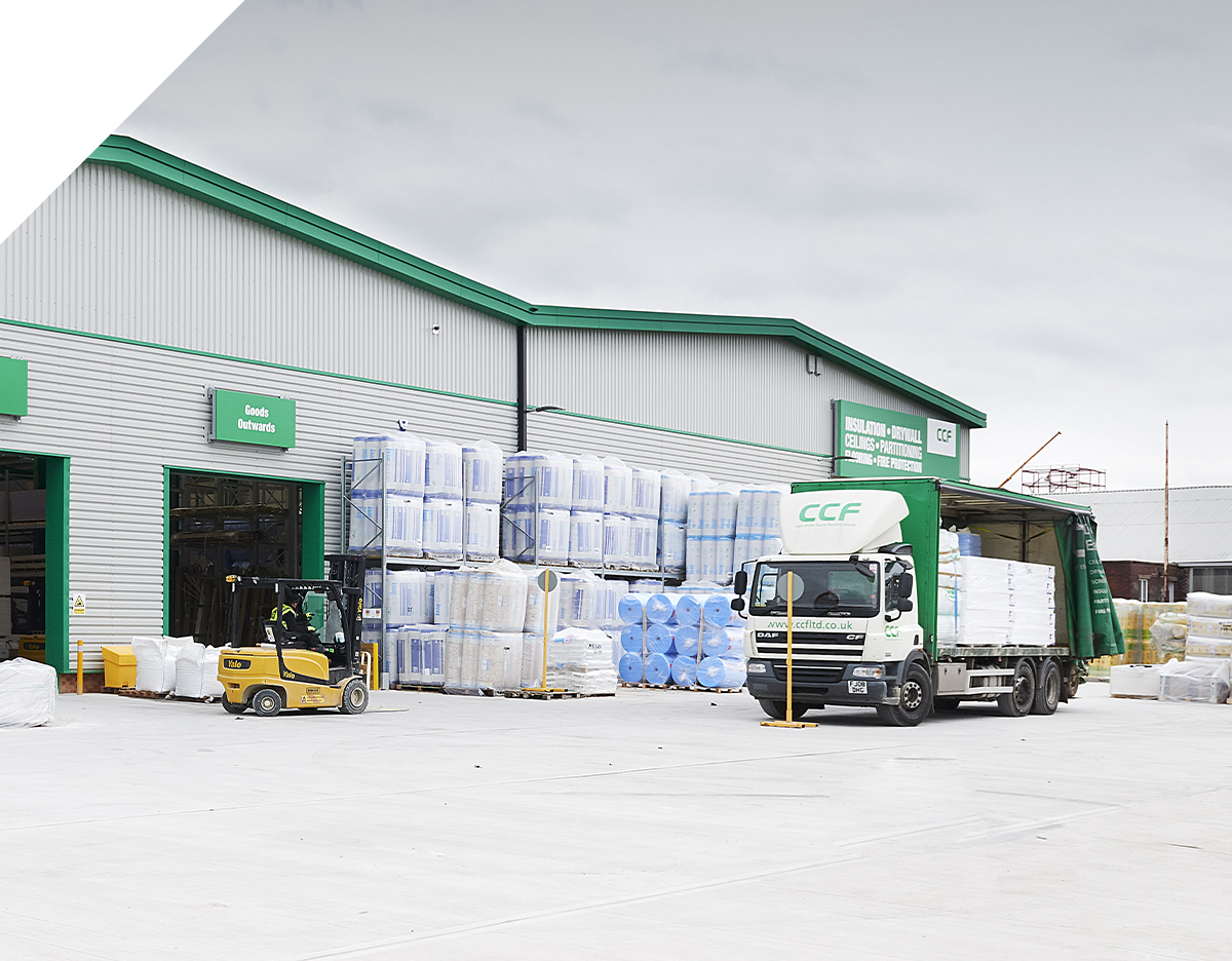 An image of a CCF truck, parked in front of a branch and full of products.
