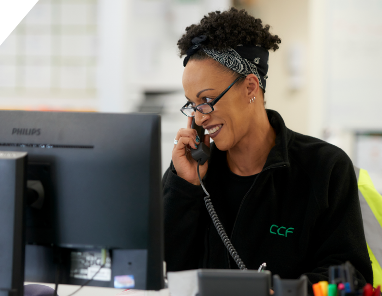 A CCF support staff answering call, smiling