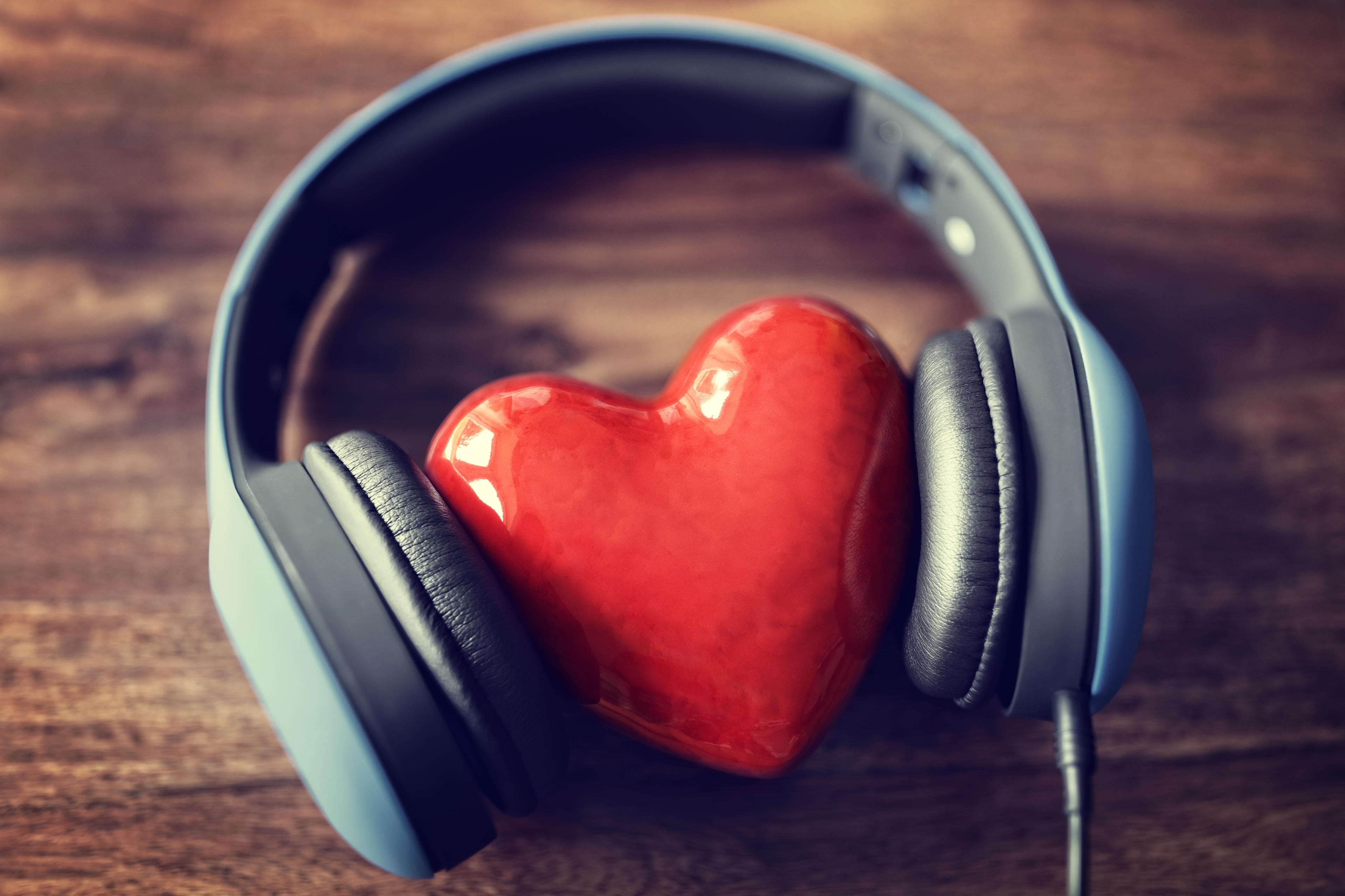 photorealistic heart between headphones 