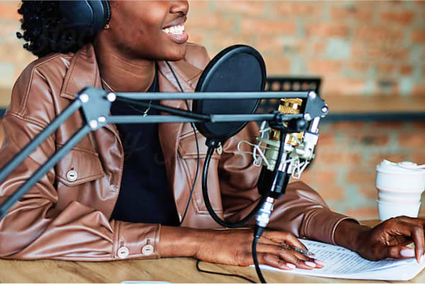 Woman talking into a microphone 