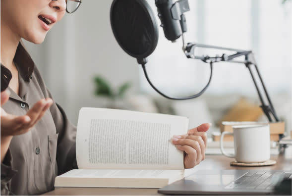 women talking on microphone