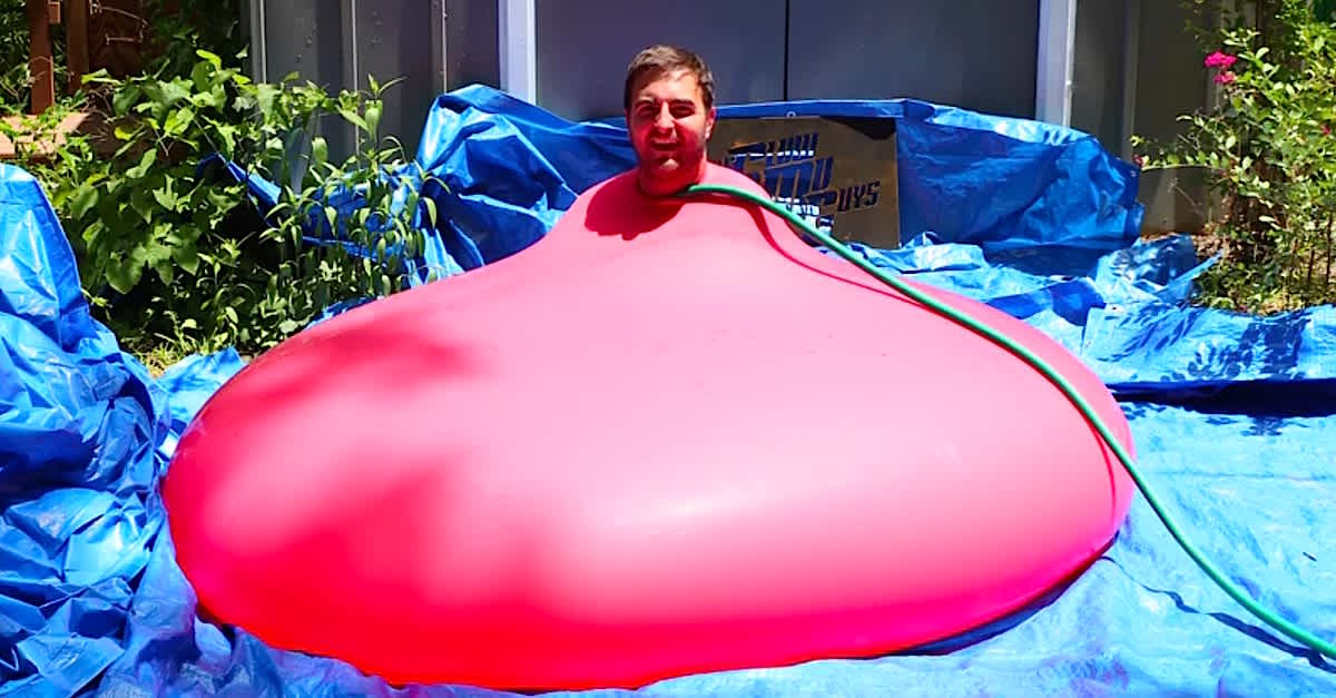 Watch This Guy Sit In A Giant Water Balloon Until It Explodes In Slow