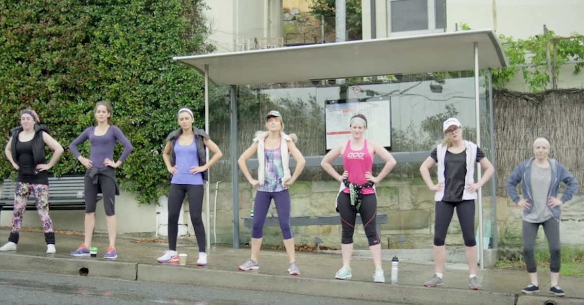 7 Women In Workout Clothes Line Up On A City Street. Now Watch As They