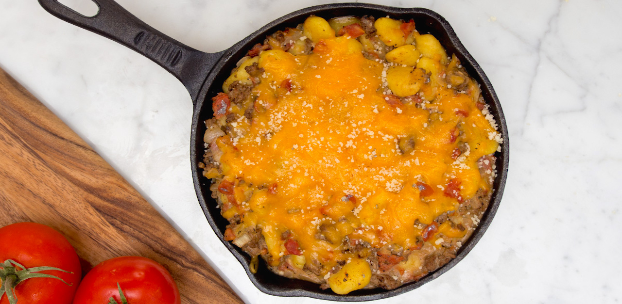 She Sautés Gnocchi In A Pan. But When She Adds Meat And Cheese