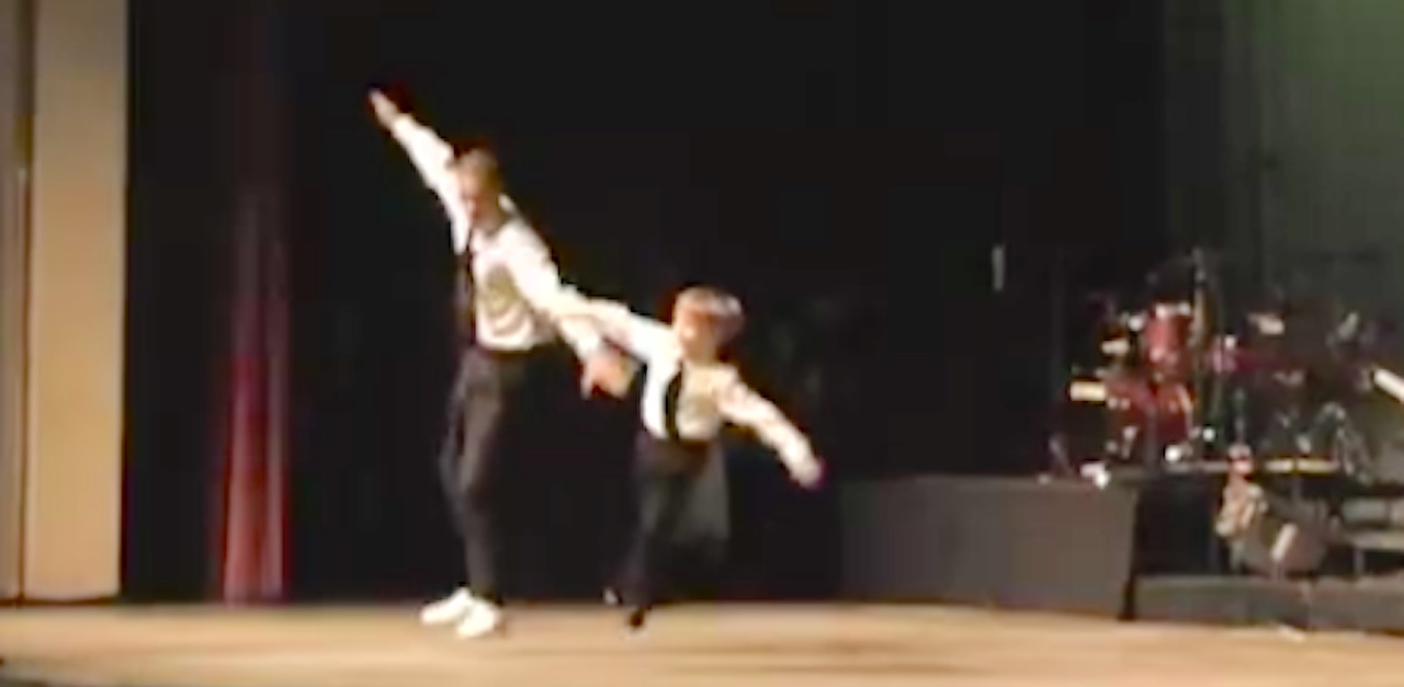 Little Boy And Grown Man Look To Each Other, Then Start TapDancing In