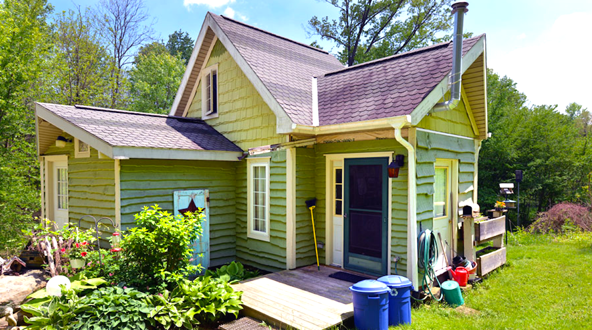 We're a married couple who live in side-by-side tiny homes & save $600 a  month - they're each designed to our own tastes