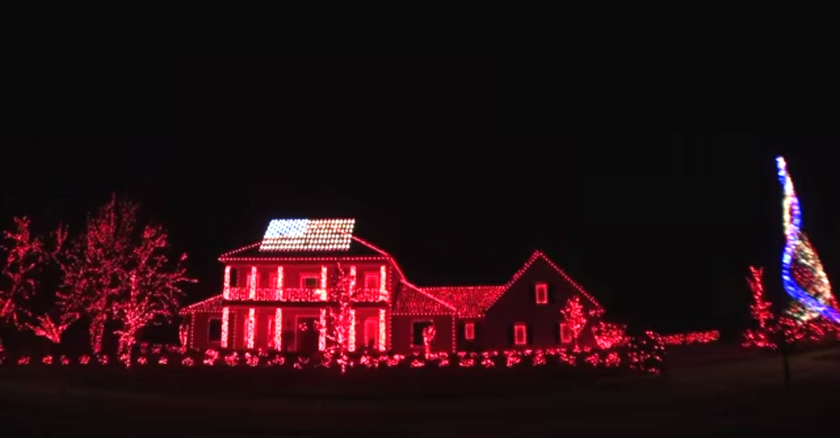 Red christmas shop lights on house