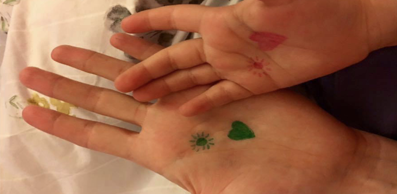 Mom Draws A Heart And Sun On Daughter's Hand To Remind Her She's Not Alone | LittleThings.com