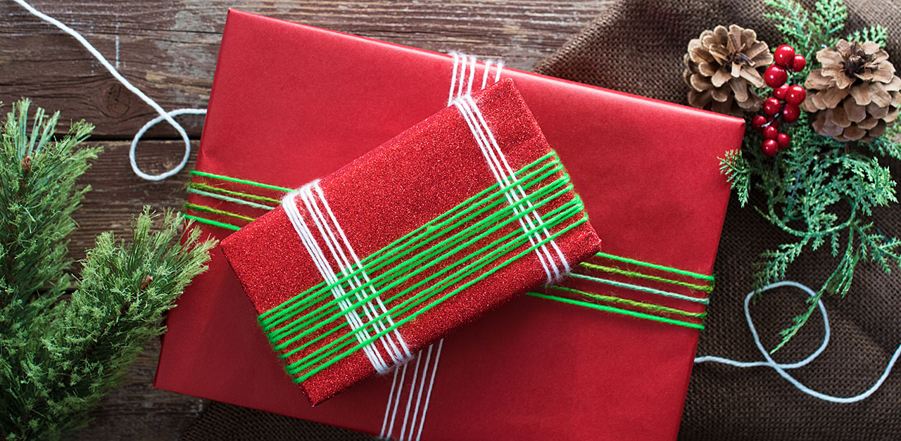 DIY Wrapped Presents With A Twist Using Yarn | LittleThings.com