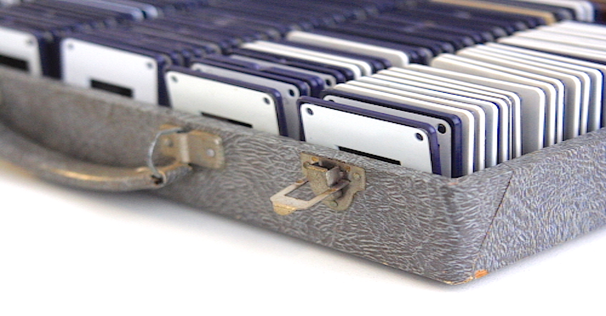 She Finds A Box Of Old Photo Slides In The Closet. What She Makes? A