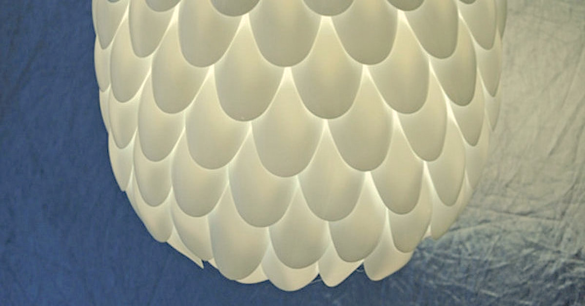 Brilliant Man Hot Glues Plastic Spoons To A Bottle To Create A Sleek