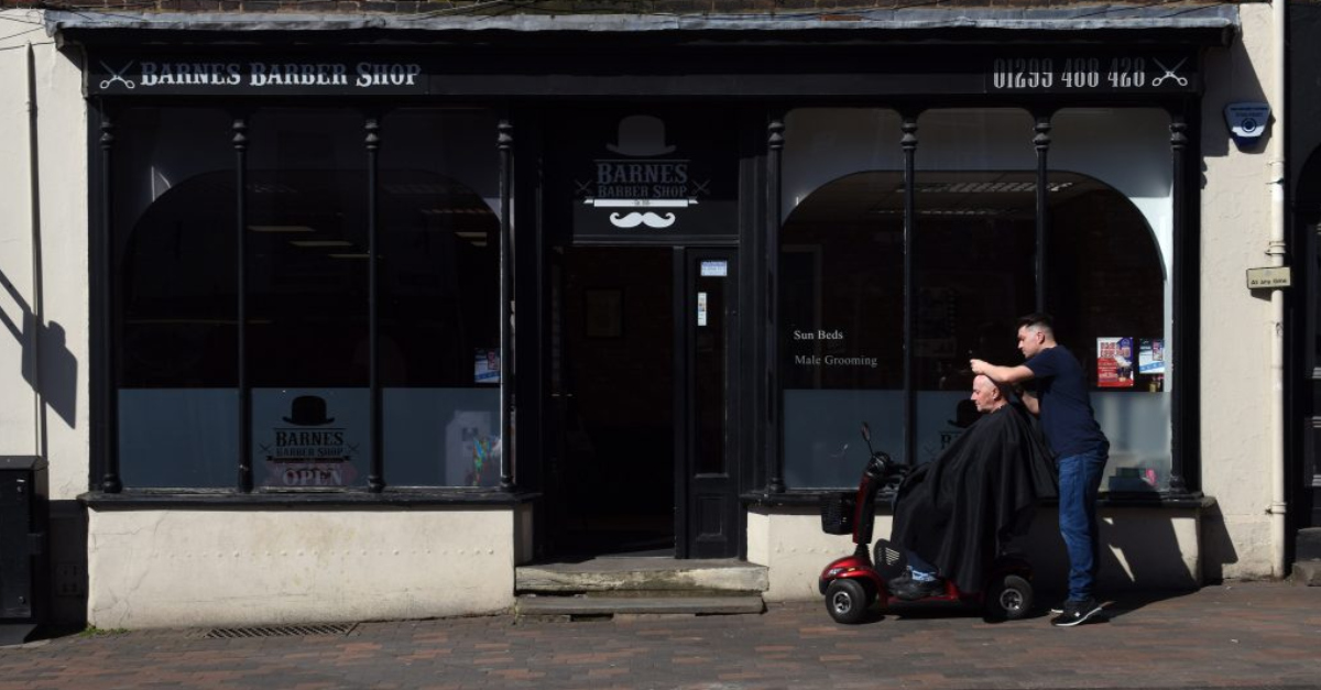 Client In Wheelchair Gets Hair Trimmed On Sidewalk By Thoughtful Barber