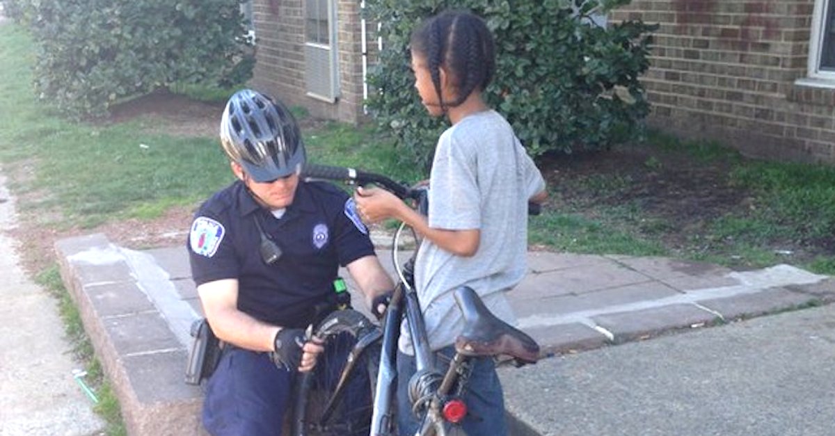 Cop Stops A Young Boy On His Bike, But Look Closely At The Officer's ...