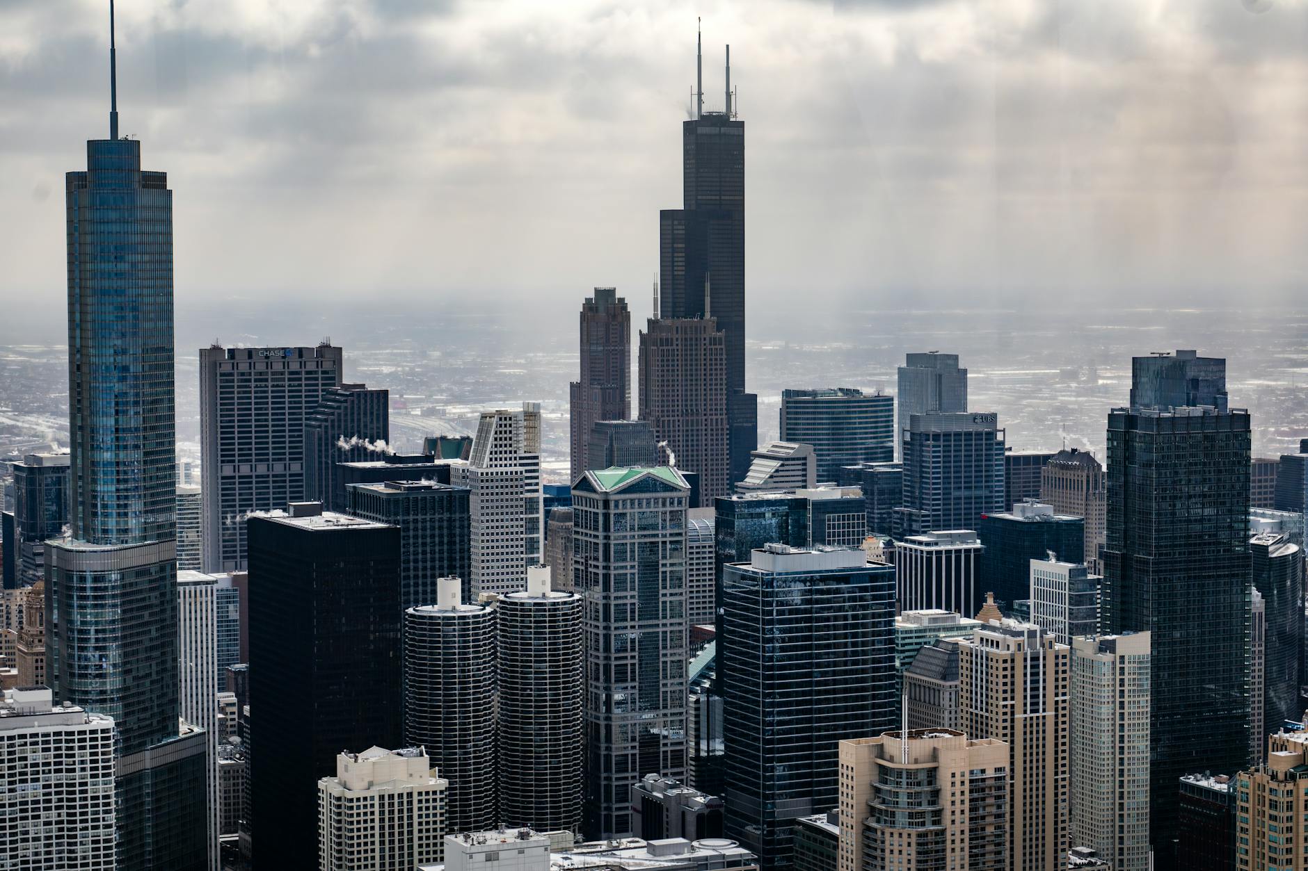 Capture of Chicago's iconic skyscrapers under a dramatic winter sky.