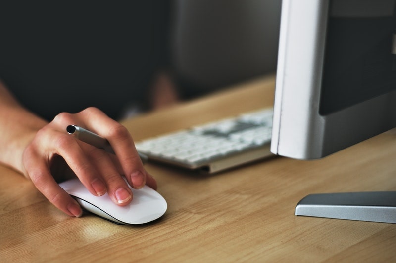 Woman using computer mouse