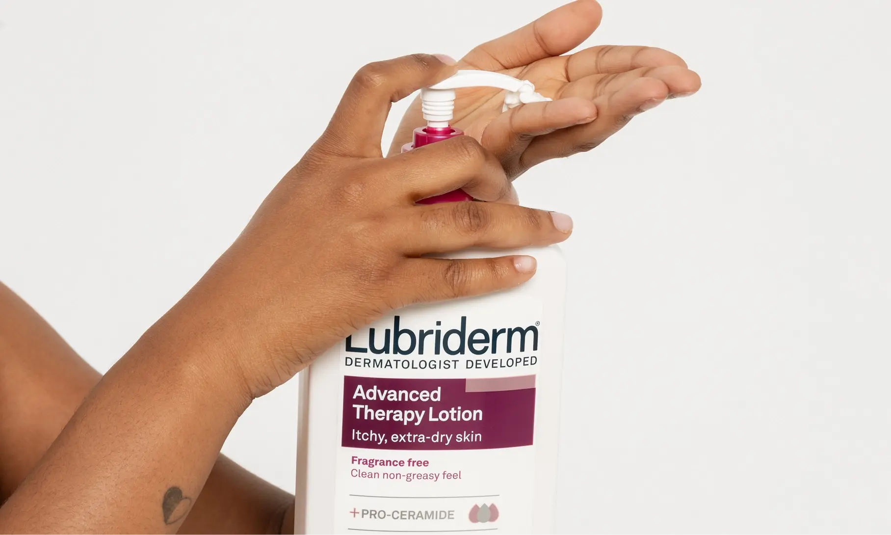An image featuring Lubriderm® Advanced Therapy Lotion being applied on hands