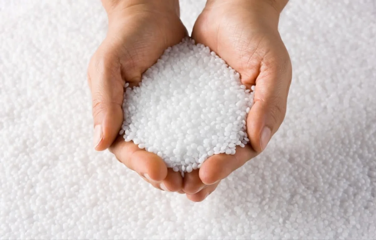 GettyImages-1335985296 female biodegradable pellets in hand