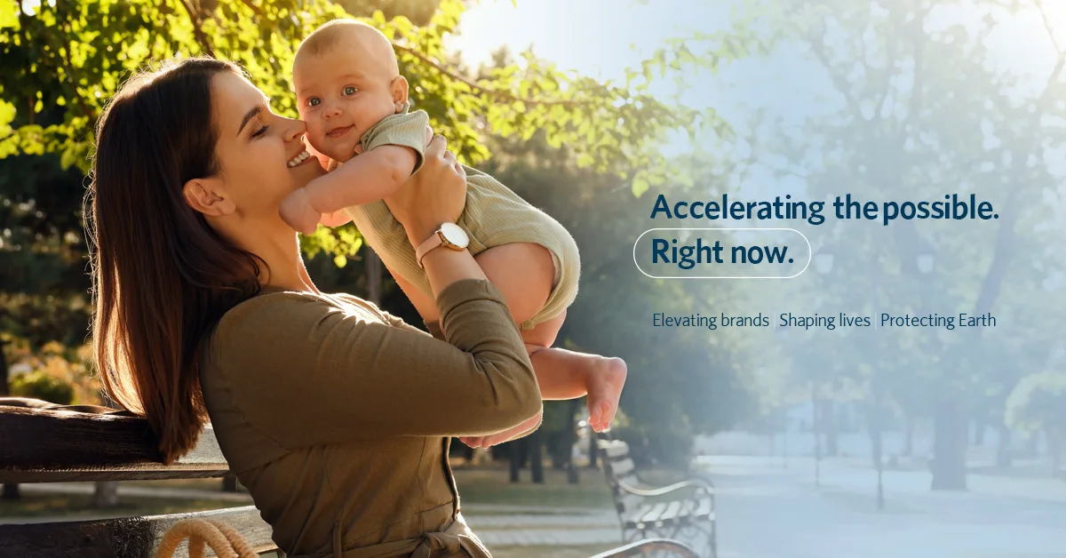 Parent and baby in sunlit park