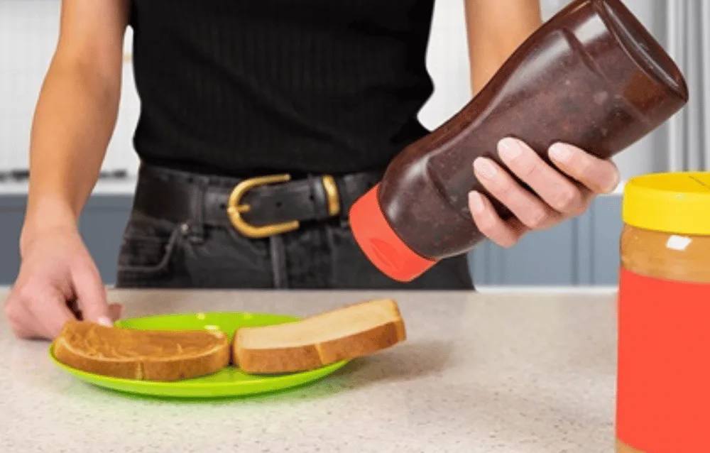 making a peanut berry sandwich