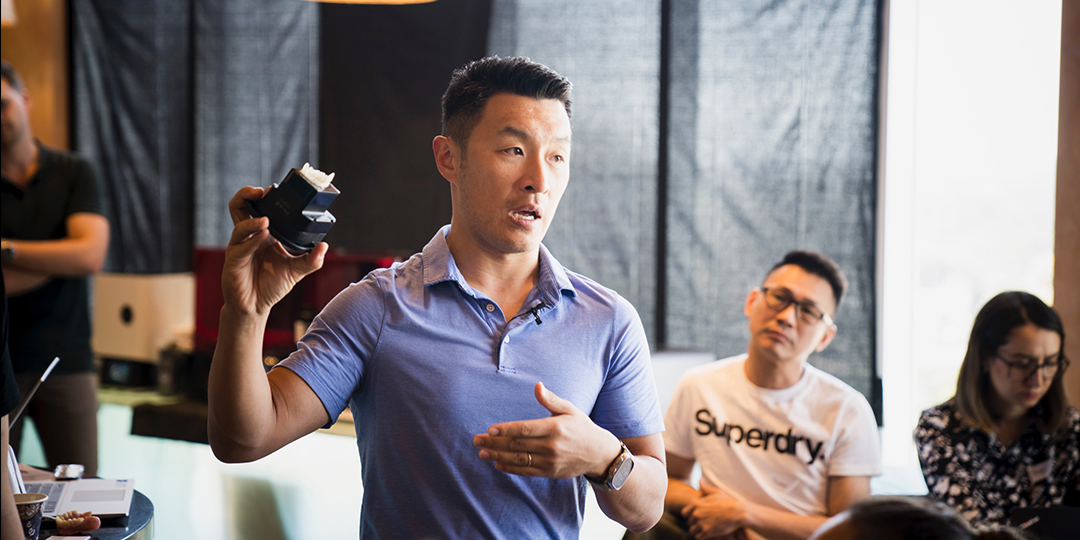 Dr Tom Shao speaking at an educational event at Vogue Dental Studios