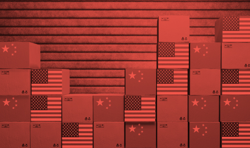 A digitally edited image features stacks of shipping boxes, some adorned with the U.S. flag and others with the Chinese flag, symbolizing trade relations between the two countries. The entire image has a red overlay, emphasizing tension or economic friction, possibly related to tariffs or trade disputes. The background consists of horizontal lines, adding to the structured and industrial feel of the composition.