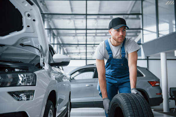 Mechanic holding a tire