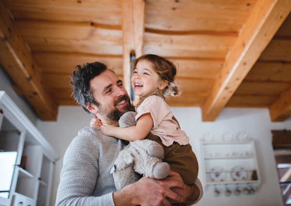 A father holding his daughter