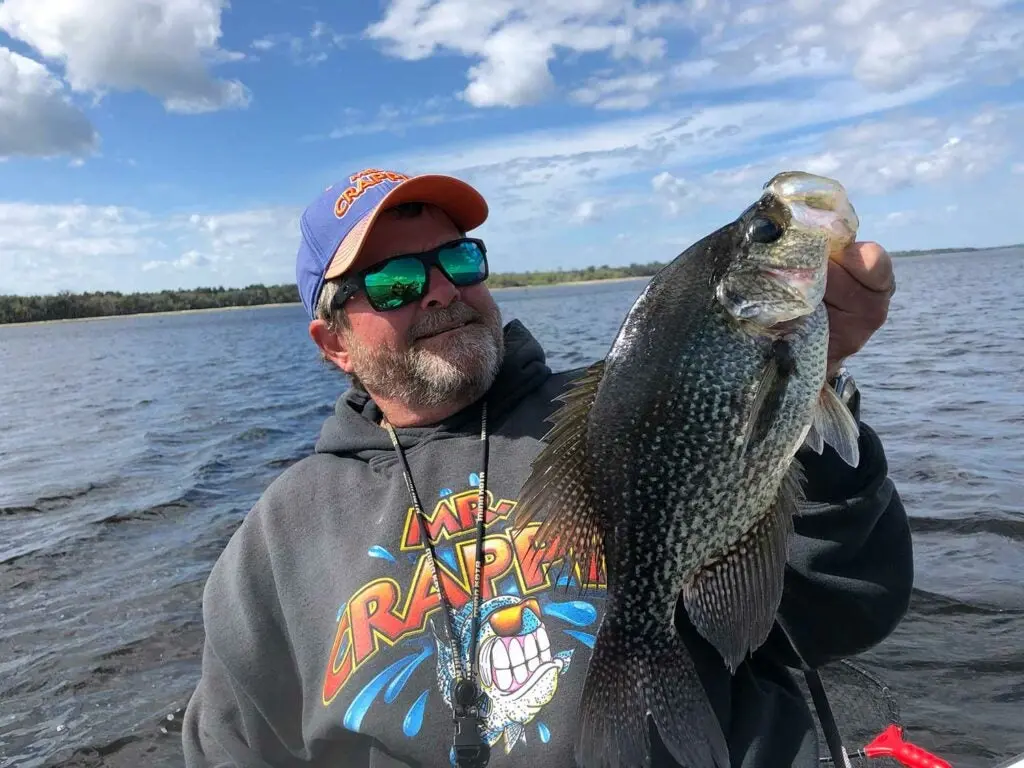 Man holding a fish. 