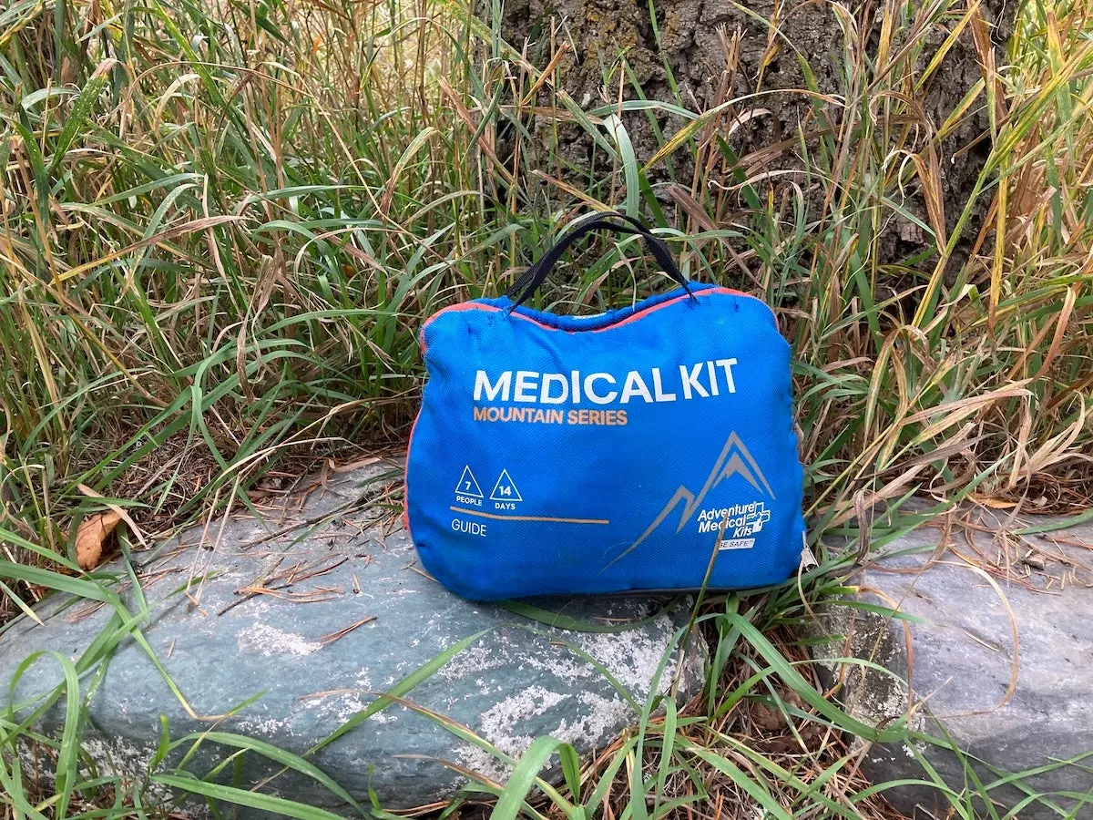 Adventure Medical Kit first aid kit sitting on rock