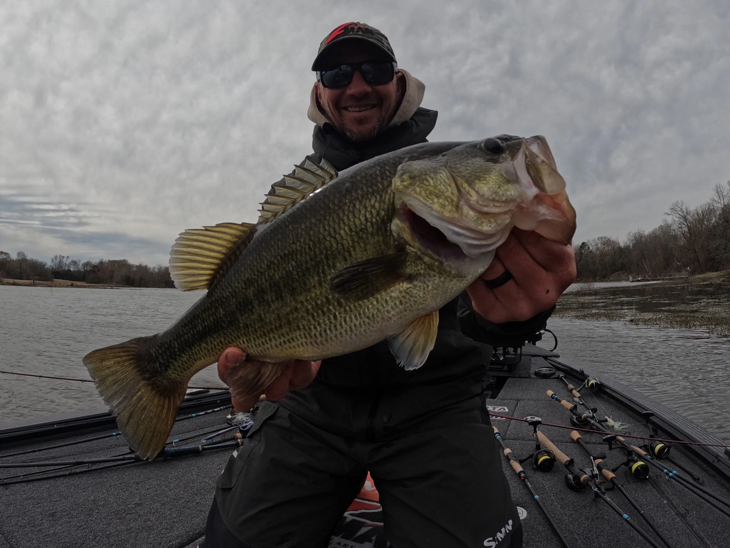 A professional angler poses with a trophy largemouth bass caught in Texas. 