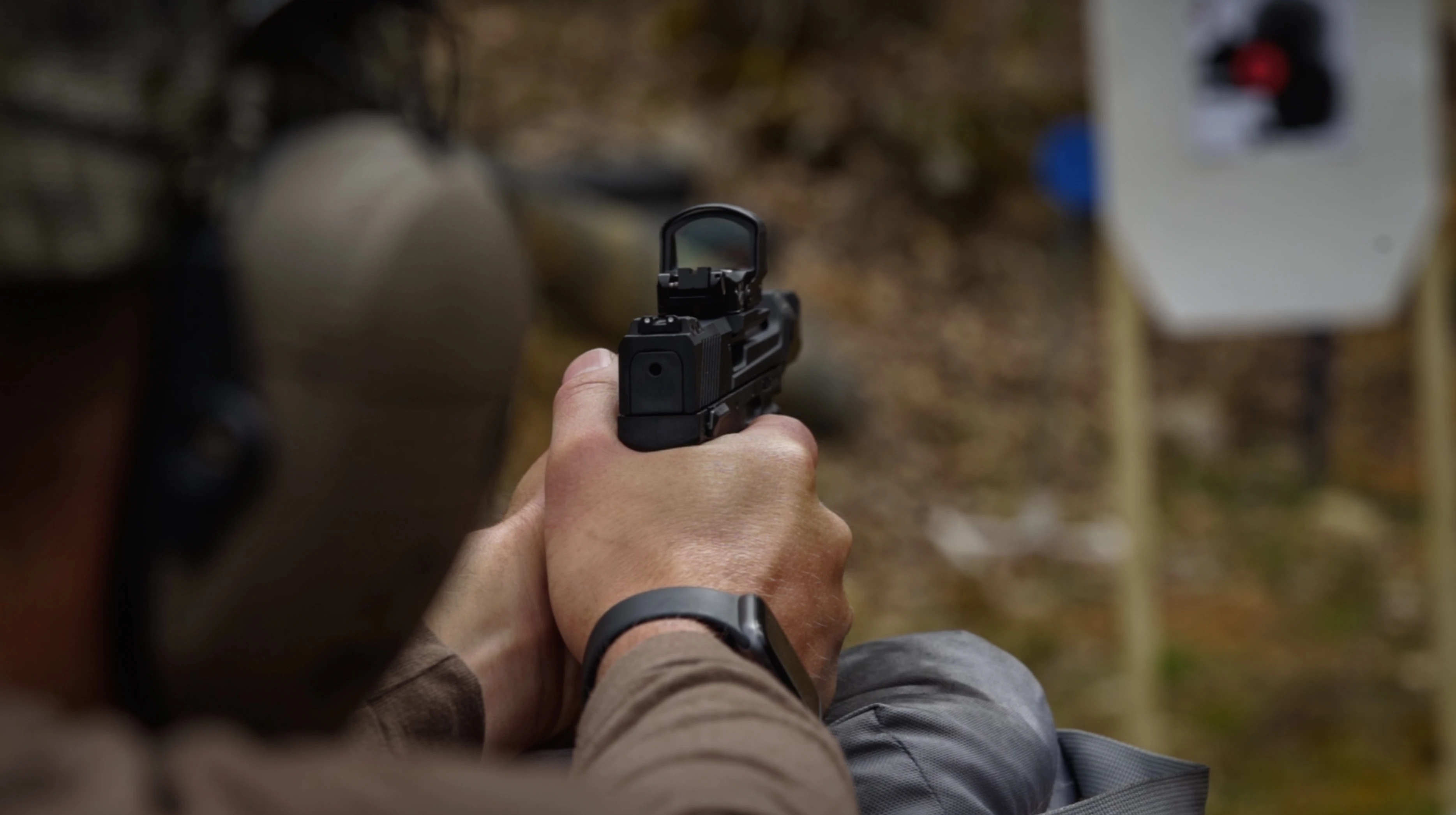 Man shooting Taurus TX 22 Competition Pistol