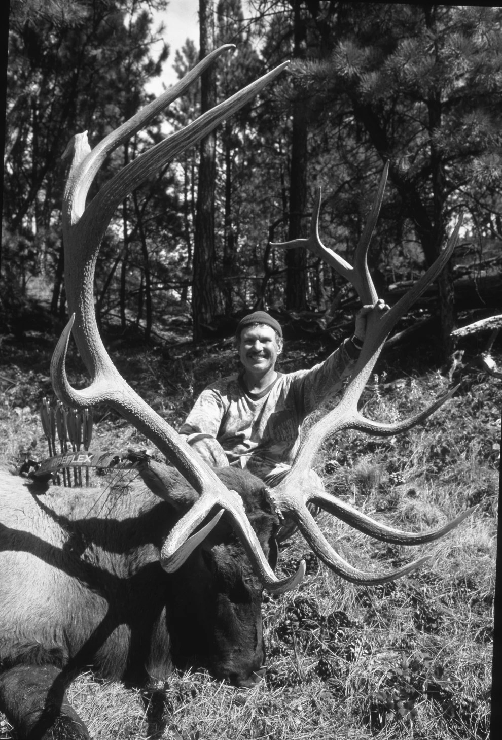 A legendary bow hunter poses with a record bull elk. 