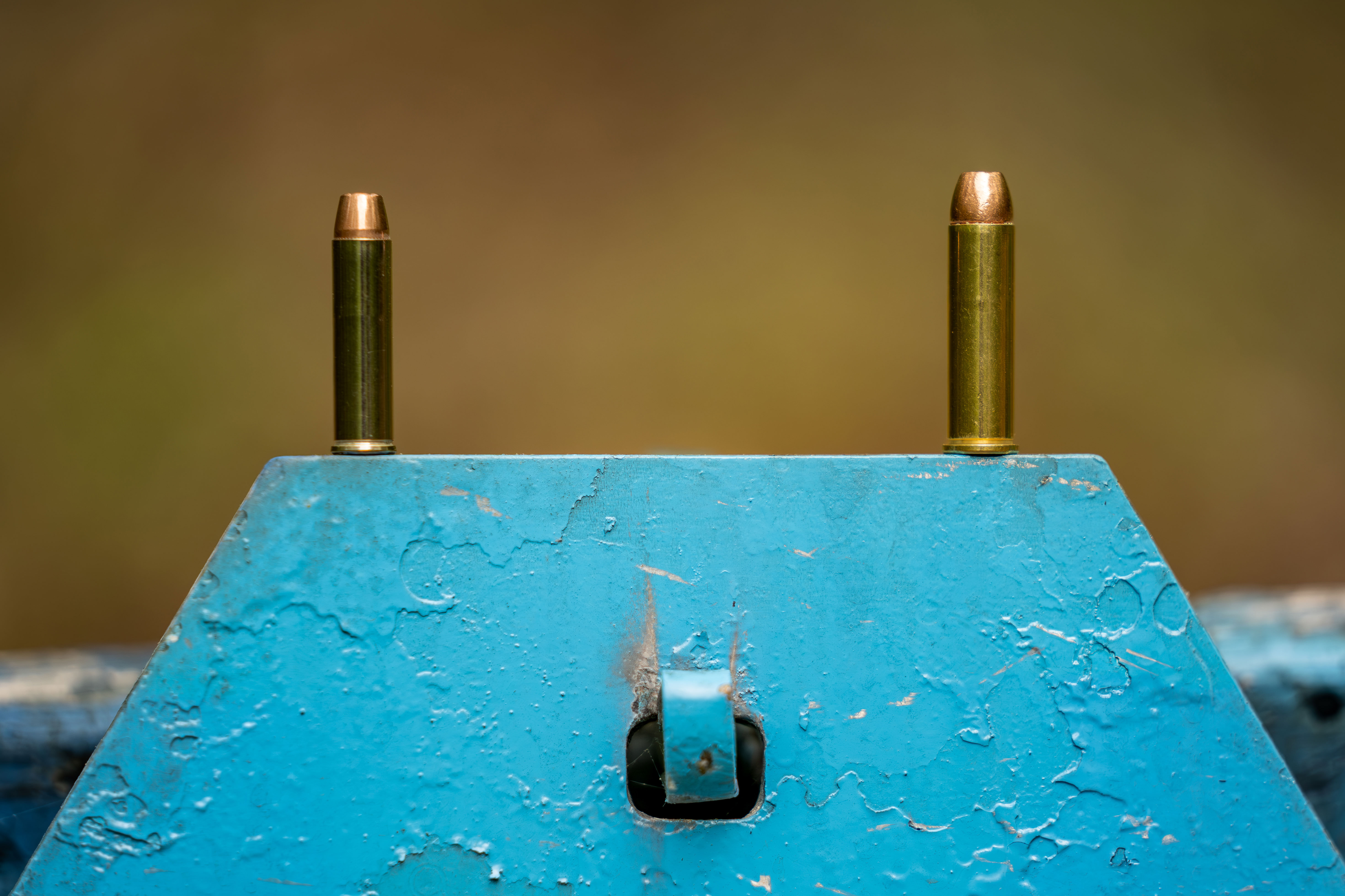 A 327 Federal Magnum cartridge next to a 357 Magnum cartridge. 