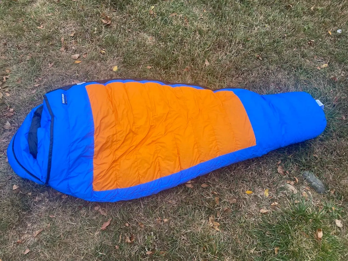 Feathered Friends Snowbunting EX 0 Sleeping Bag laid out on grass