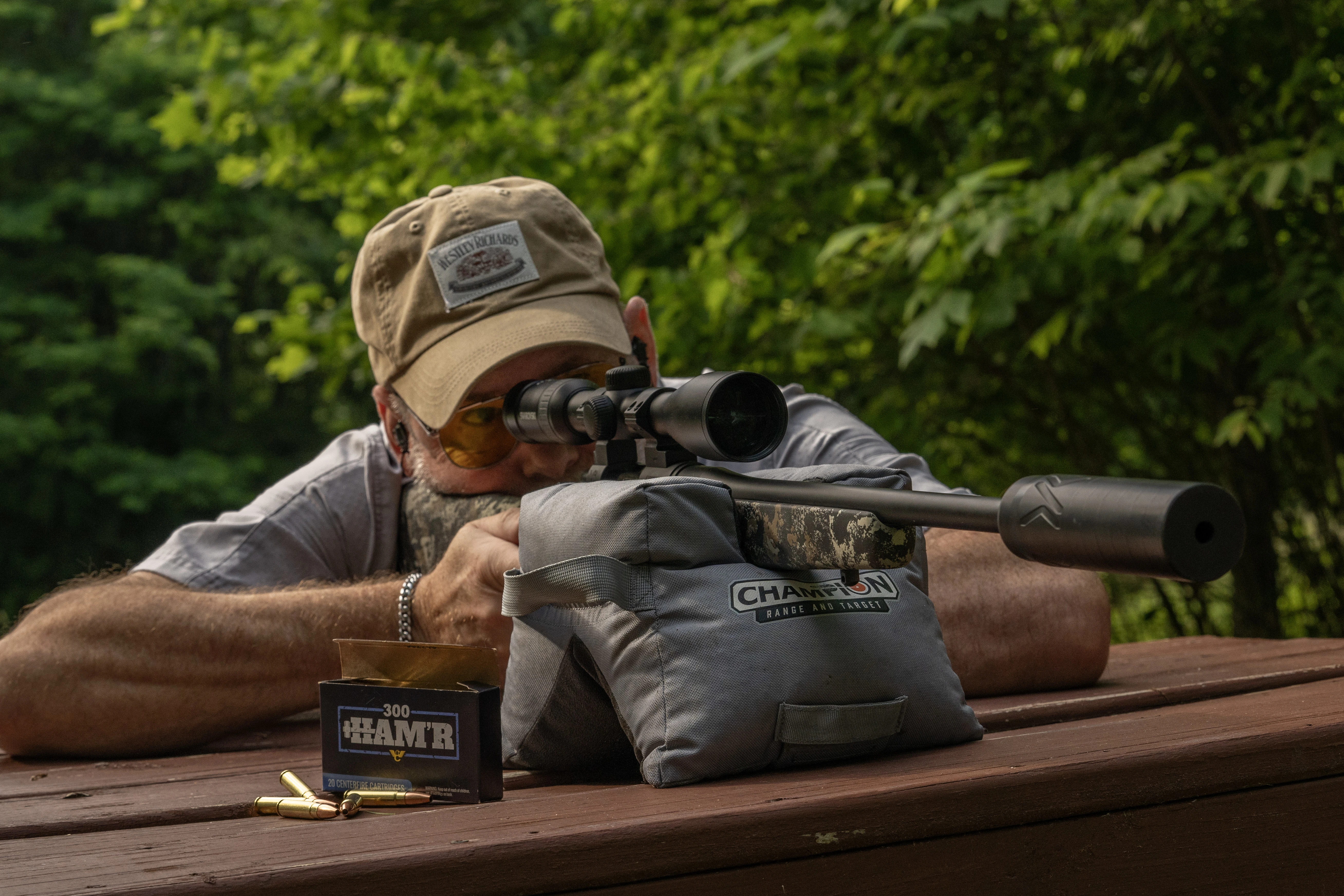 A shooter test fires the new Wilson Combat Model 20S bolt-action rifle from a bench rest. 