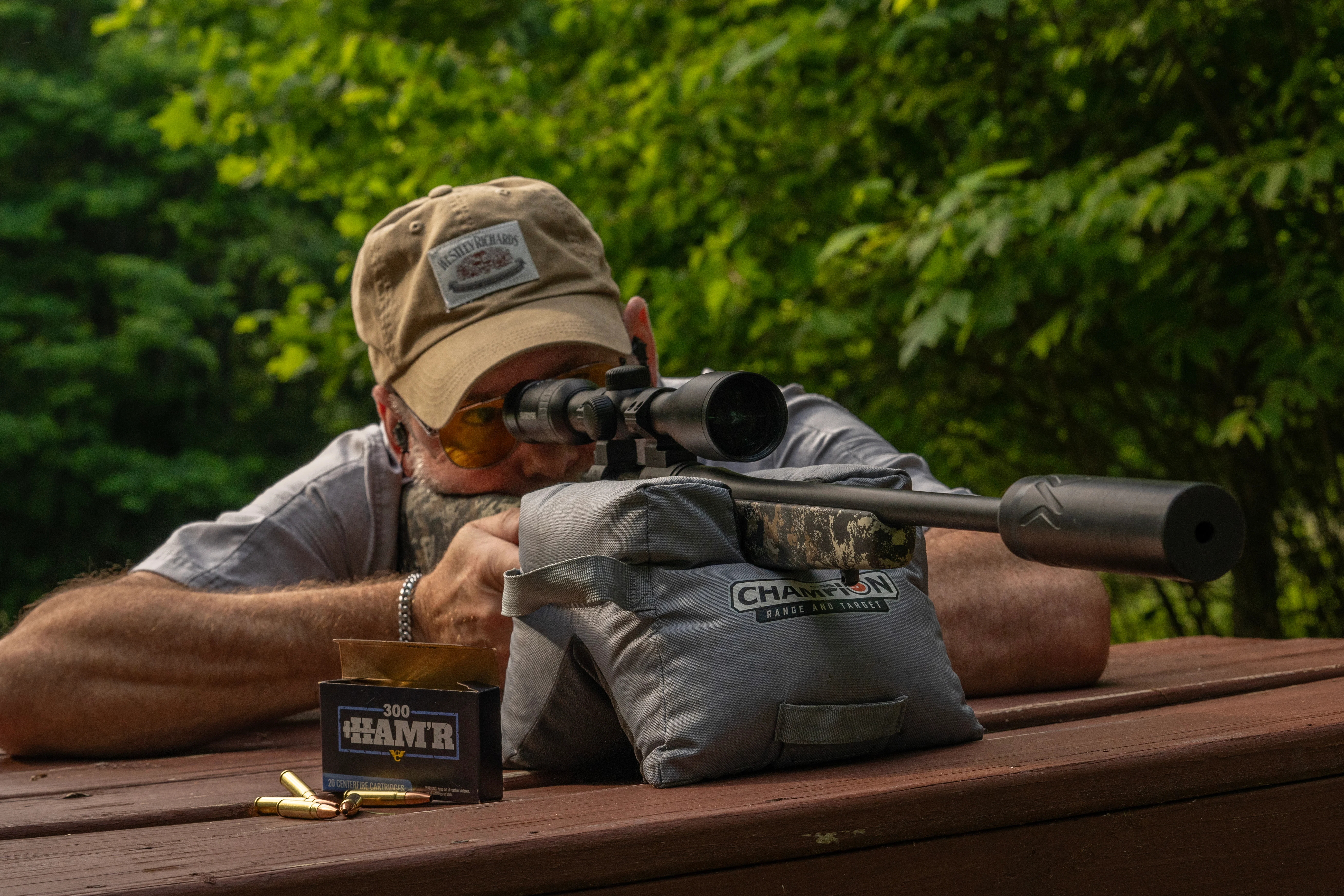 A shooter test fires the new Wilson Combat Model 20S bolt-action rifle from a bench rest. 