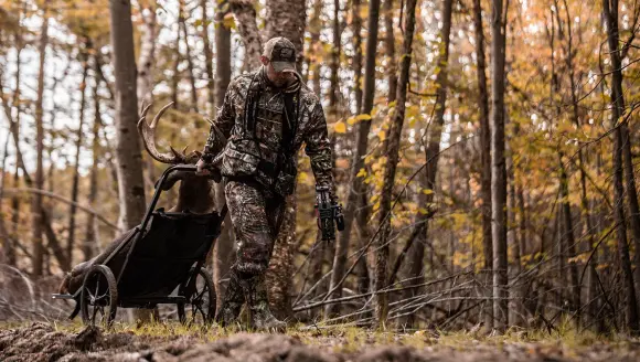 photo of hunter with buck