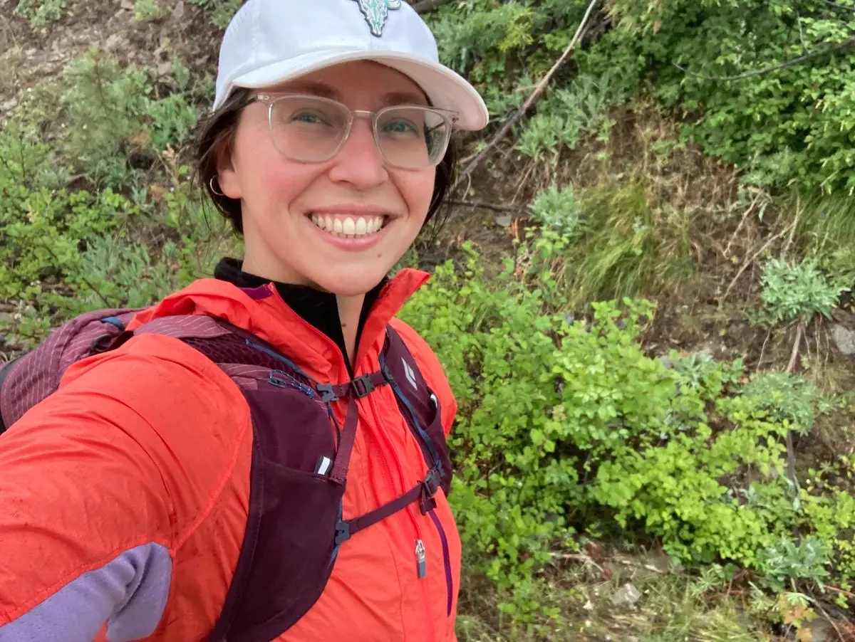 Female hiker wearing Icebreaker Shell+ Merino Cotton Windbreaker