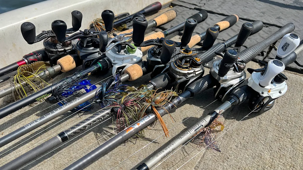 Seven fishing rods on the deck of a bass boat