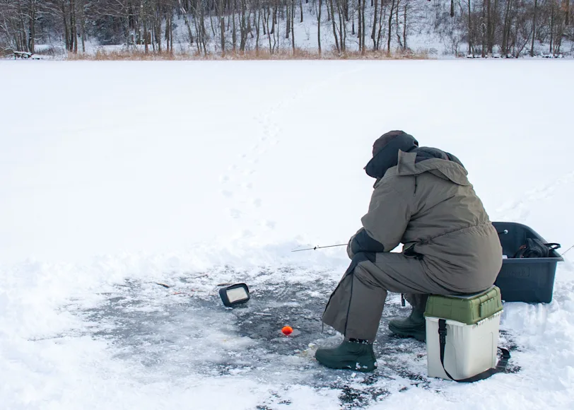 An ice angler uses sonar to locate fish.