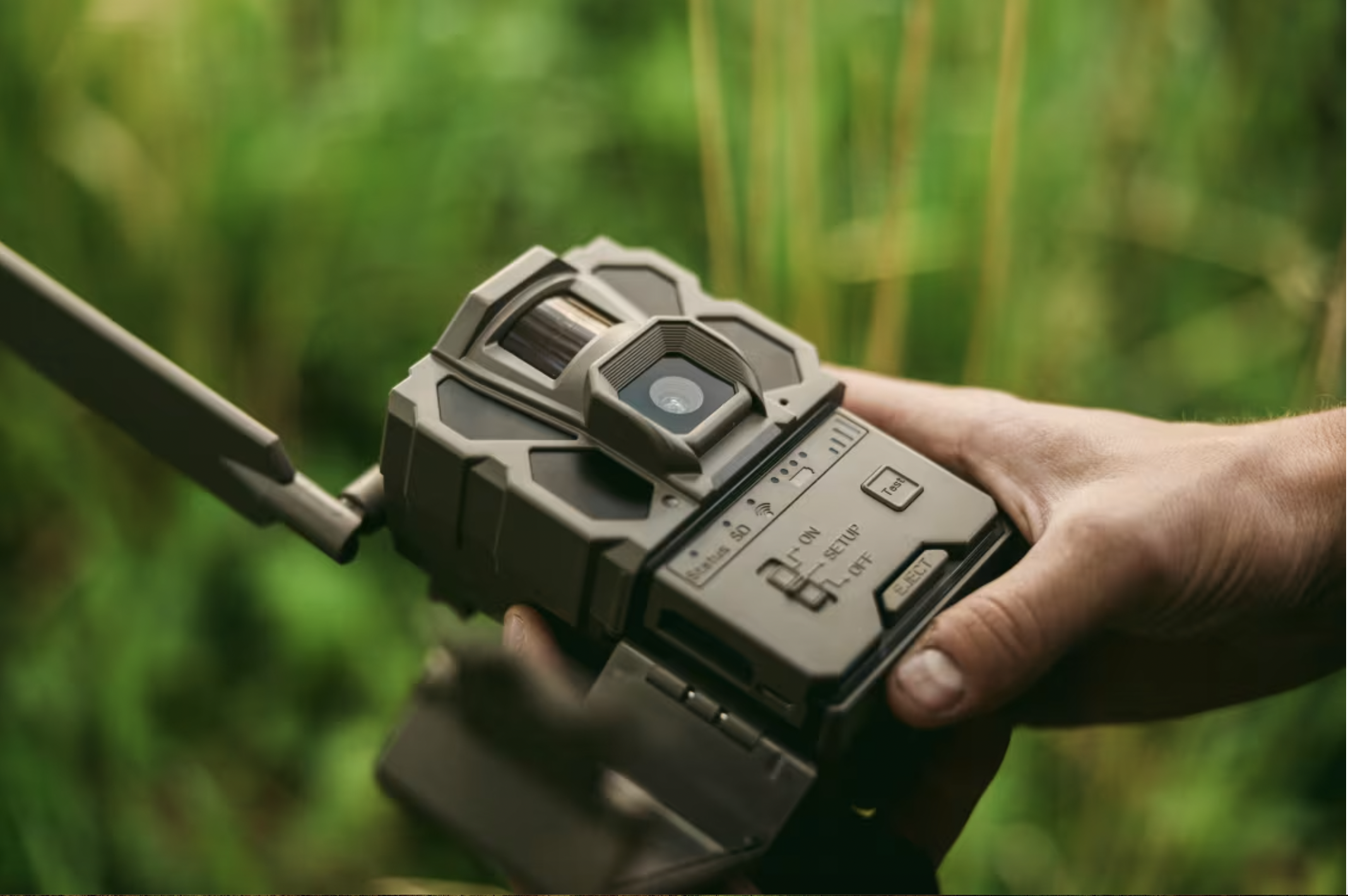 A hunter sets up the new Tactacam X 3.0 cellular trail camera in the field. 