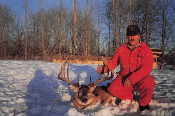 Milo Hanson poses with his Boone and Crockett World's Record for typical whitetail buck.