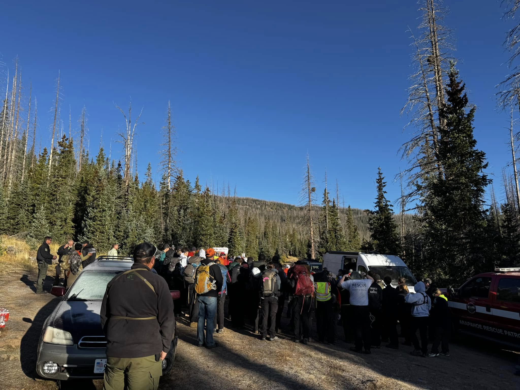 Search and rescue members looking for two missing elk hunters photographed in southwest Colorado. 