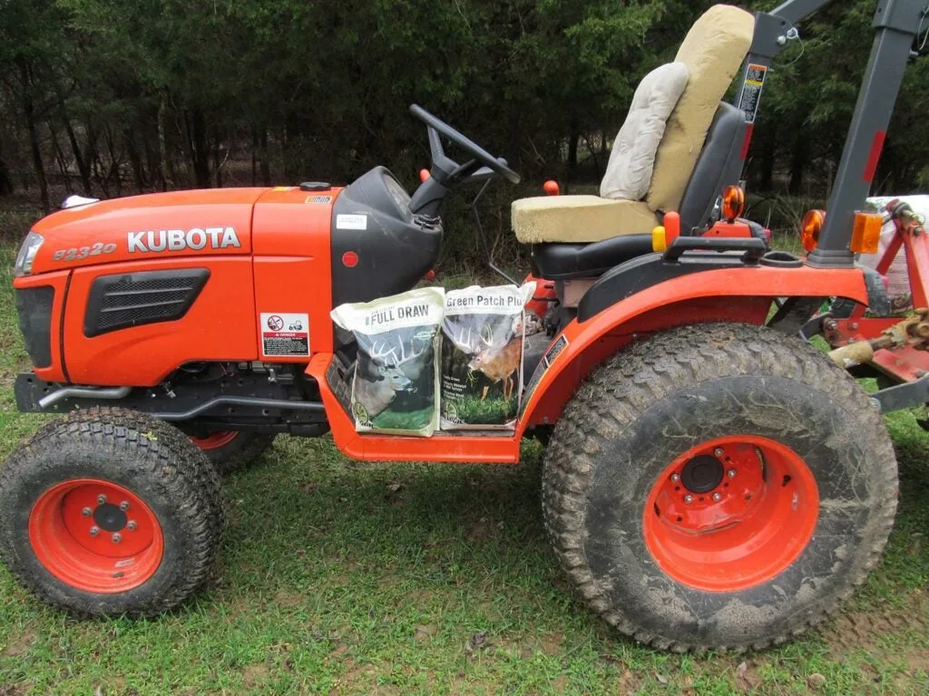 A yard-tilling tractor with seeds.