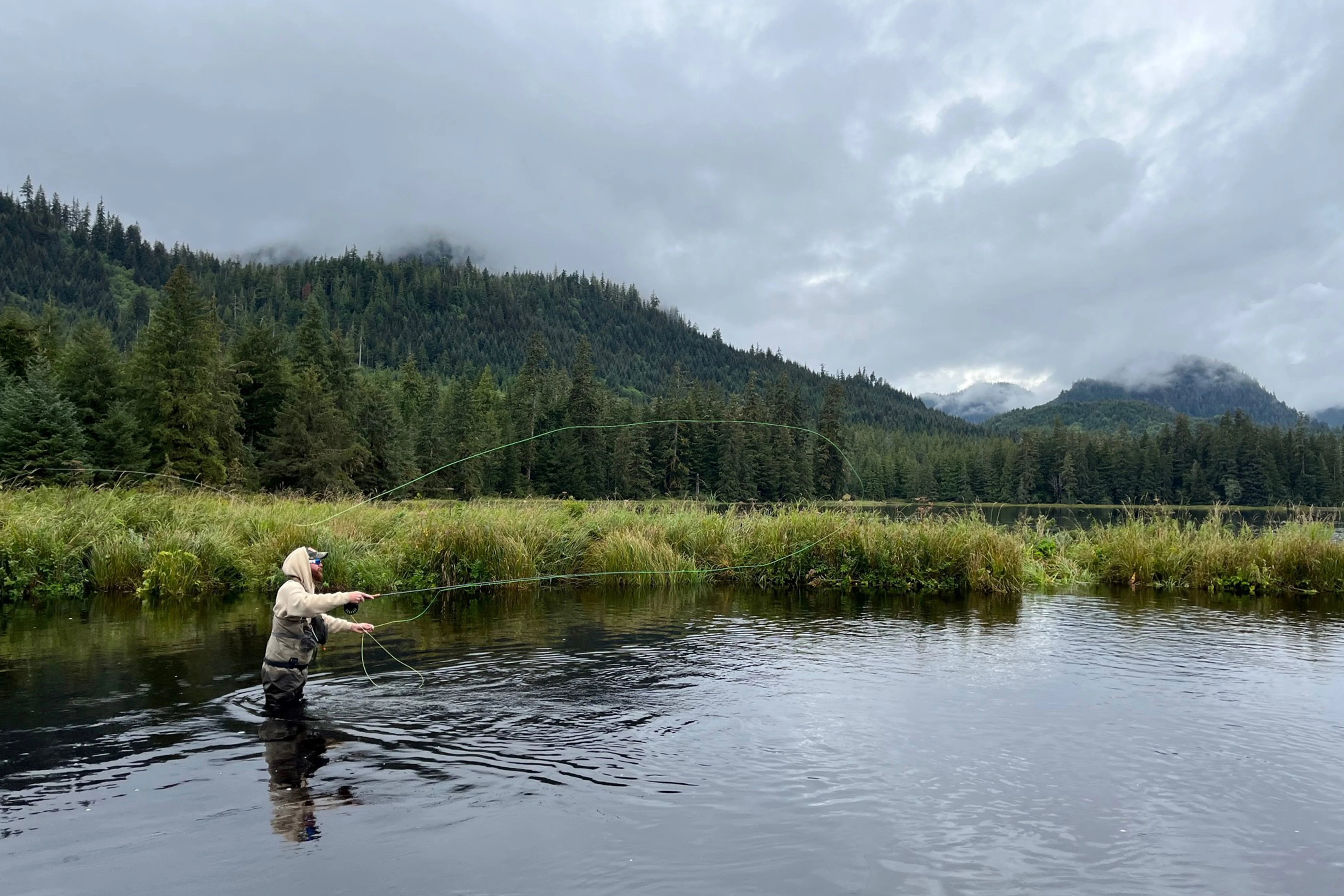 An fly fisherman in the Tongass National Forest in southeast Alaska.