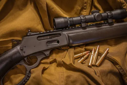 A Marlin 336 rifle on a burlap cloth.