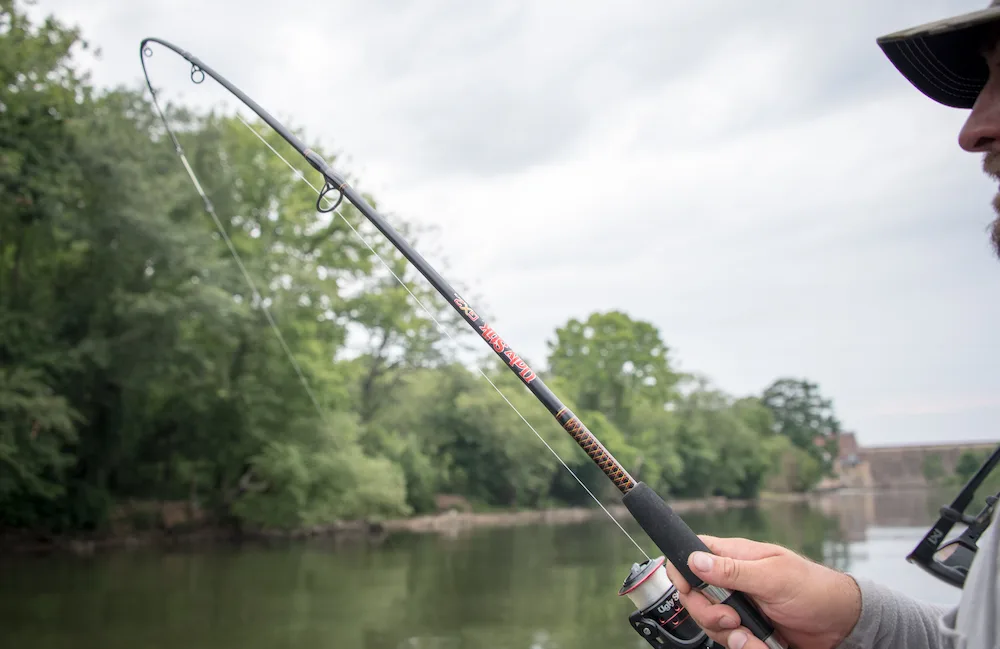 Angler casting Ugly Stik fishing rod