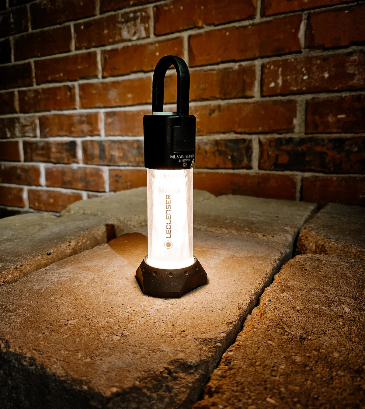 Ledlenser Lantern sitting on ground turned on