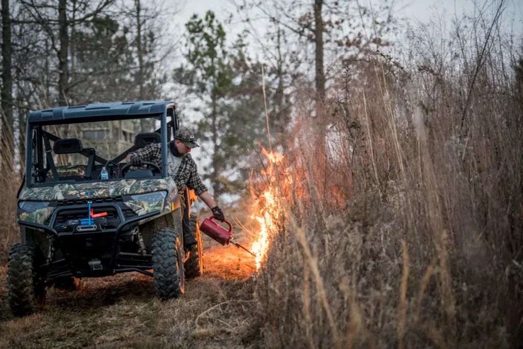 Turkey hunter performs a prescribed burn on public land.