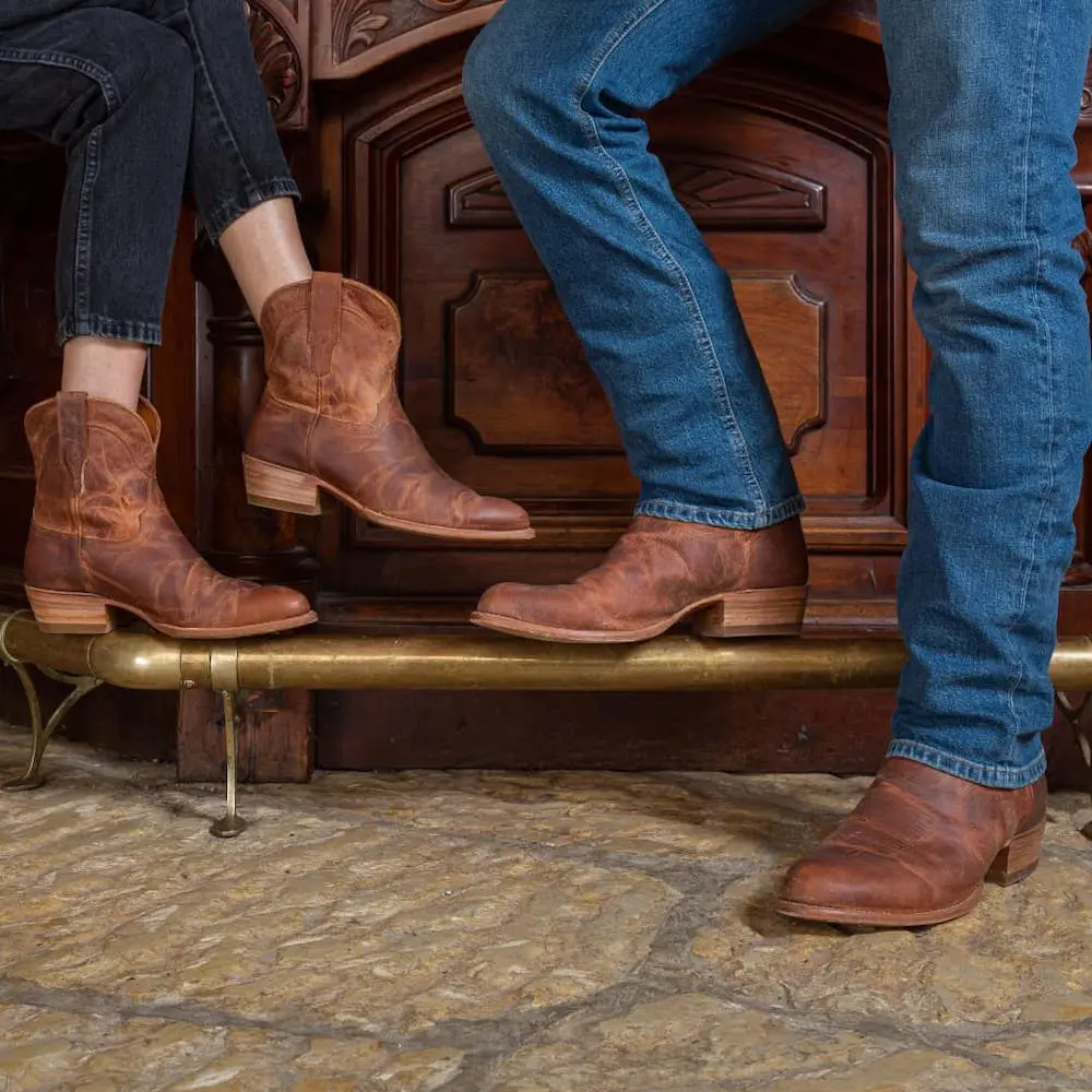 Man and woman wearing Tecovas Scotch Goat cowboy boots